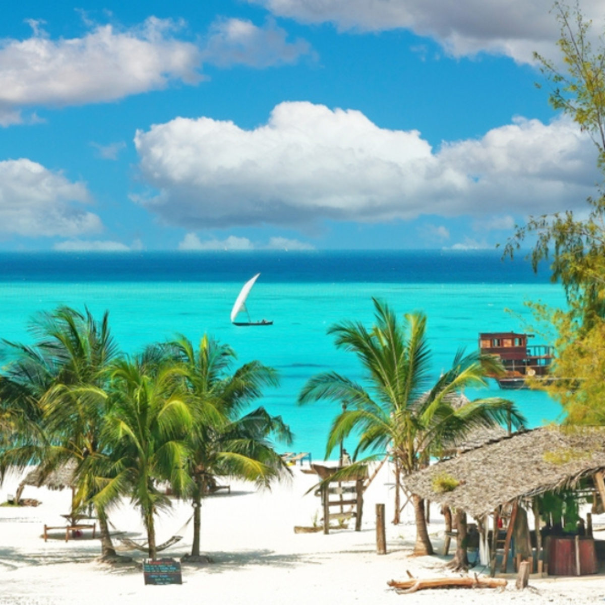 beach, sun beds, palm trees, bamboo hut bar, turquoise water - Paje, Zanzibar