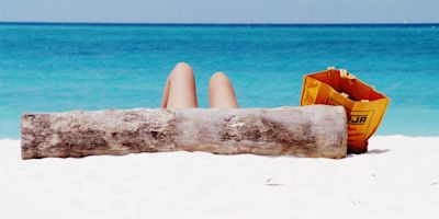 Sun-bathing on Kendwa Beach, Zanzibar Island off the coast of Tanzania, Africa