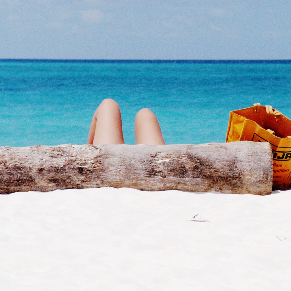 Sun-bathing on Kendwa Beach, Zanzibar Island off the coast of Tanzania, Africa