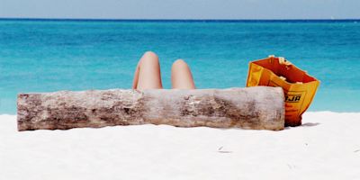 Sun-bathing on Kendwa Beach, Zanzibar Island off the coast of Tanzania, Africa
