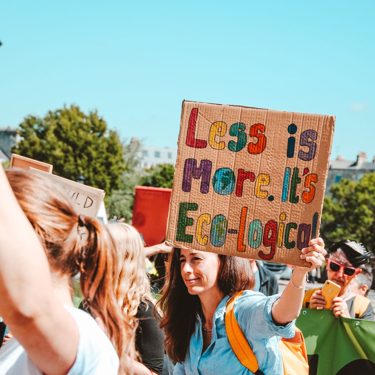 Less is more protester sign eco-friendly zero waste