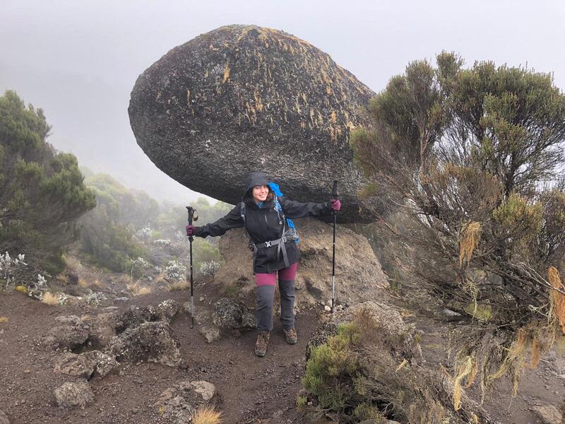 Arwa by big boulder on Kilimanjaro