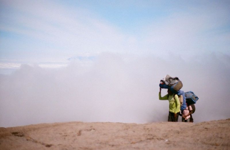 Porters on Kilimanjaro with clouds behind, August 2022 