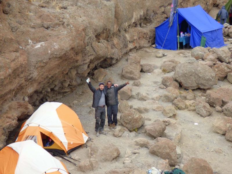 Tents and happy trekkers on Kilimanjaro