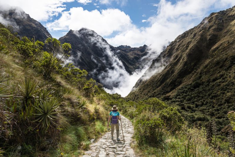 Woman walking on The Inca Trail, Machu Picchu, Peru 