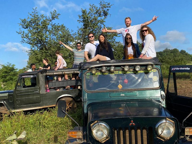 Group photo on safari vehicle