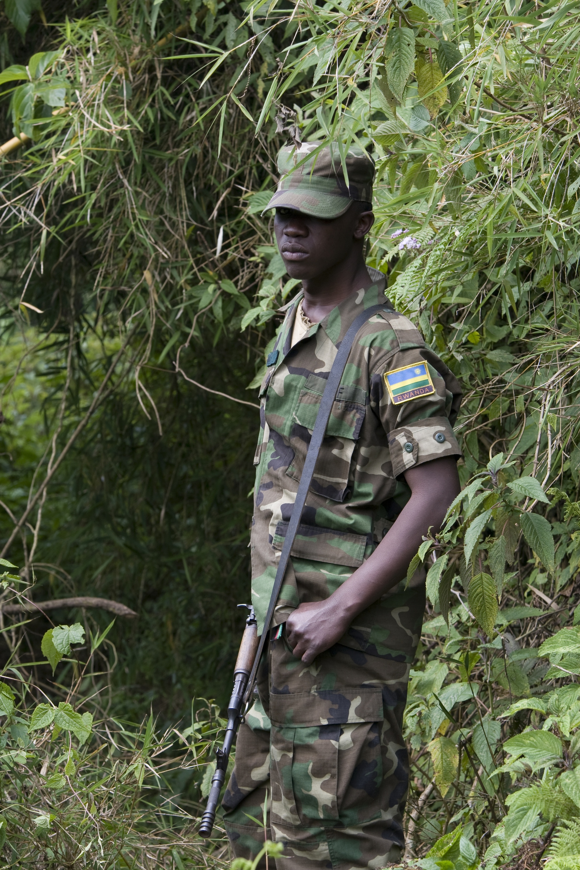 Rwandan military personnel accompany tourists on gorilla treks into the Volcanoes National Park area which borders Democratic Republic of Congo and Uganda.