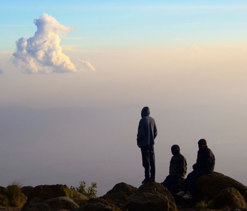 Trekkers and clouds on the Lemosho route, Kilimanjaro