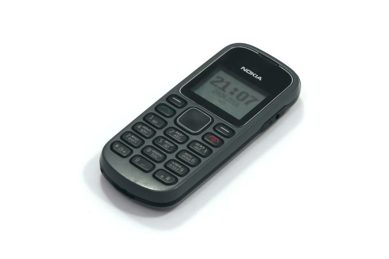 Old Nokia phone on white background