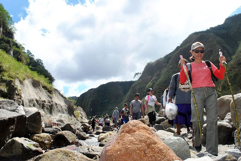 Group of trekkers in river valley