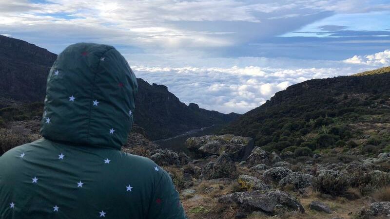 Arwa looking over clouds at Shira 2 Camp on Kilimanjaro