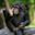 Ours. Cropped image of common chimpanzee seated on a rock