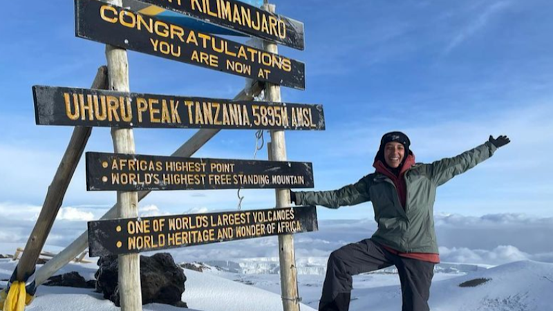 Happy climber at Uhuru sign