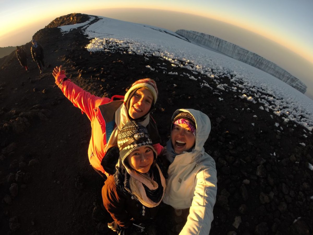 Smiling-women-with-Kilimanjaro-glacier-in-background-1024x768.jpg