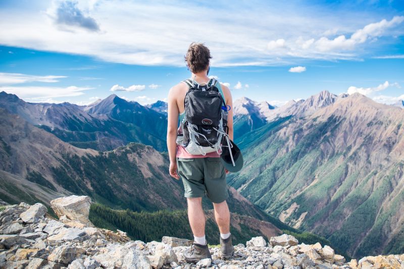 Young man hiking in mountains