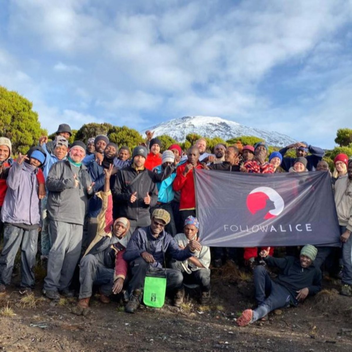 Group Picture Kilimanjaro Team Holding Flag