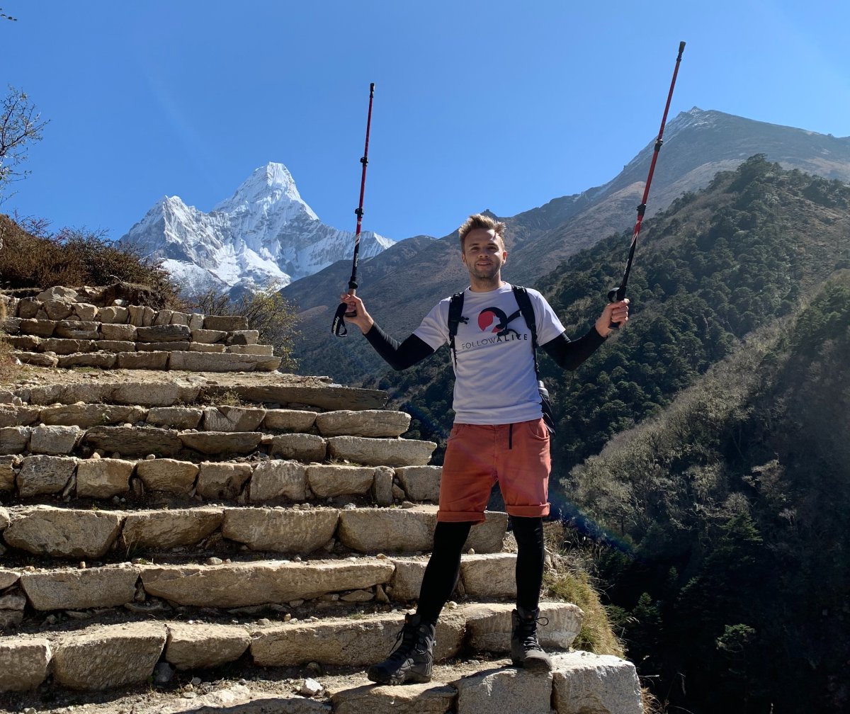 Ours. Dez with trekking poles on stairs in EBC trek Nepal