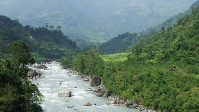 River in lush valley of Annapurna mountains