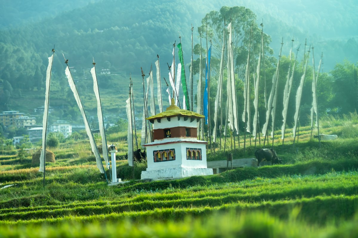 Bhutan dzong with white flags