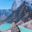 Pur. A man standing on a rock in front of Chola lake and Tabuche foothills. Everest Base Camp 3 Passes Trek, Nepal (1)