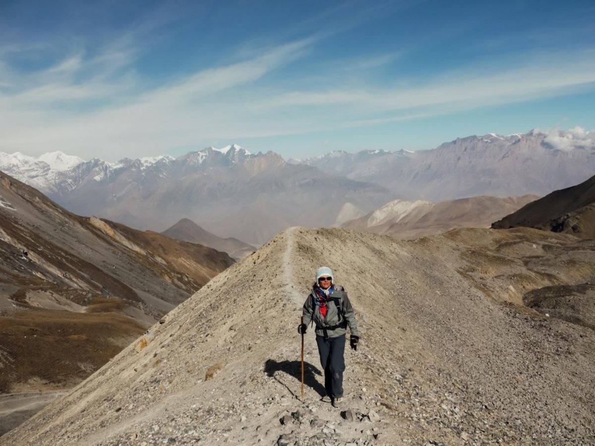 lady with poles hiking on the Annapurna circuit trek