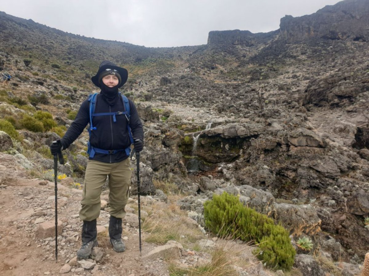 Trekker in warm clothing on Kilimanjaro, Kilimanjaro safety