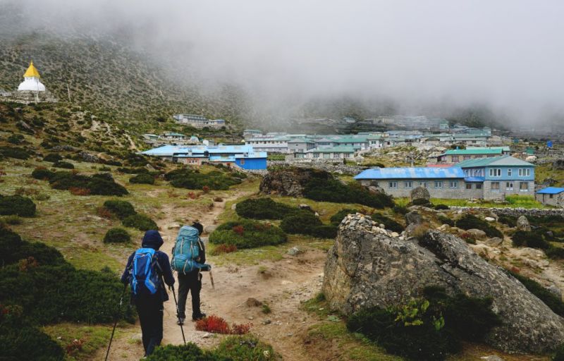 Trekkers walking into Dingboche, Nepal, Everest Base Camp packing list