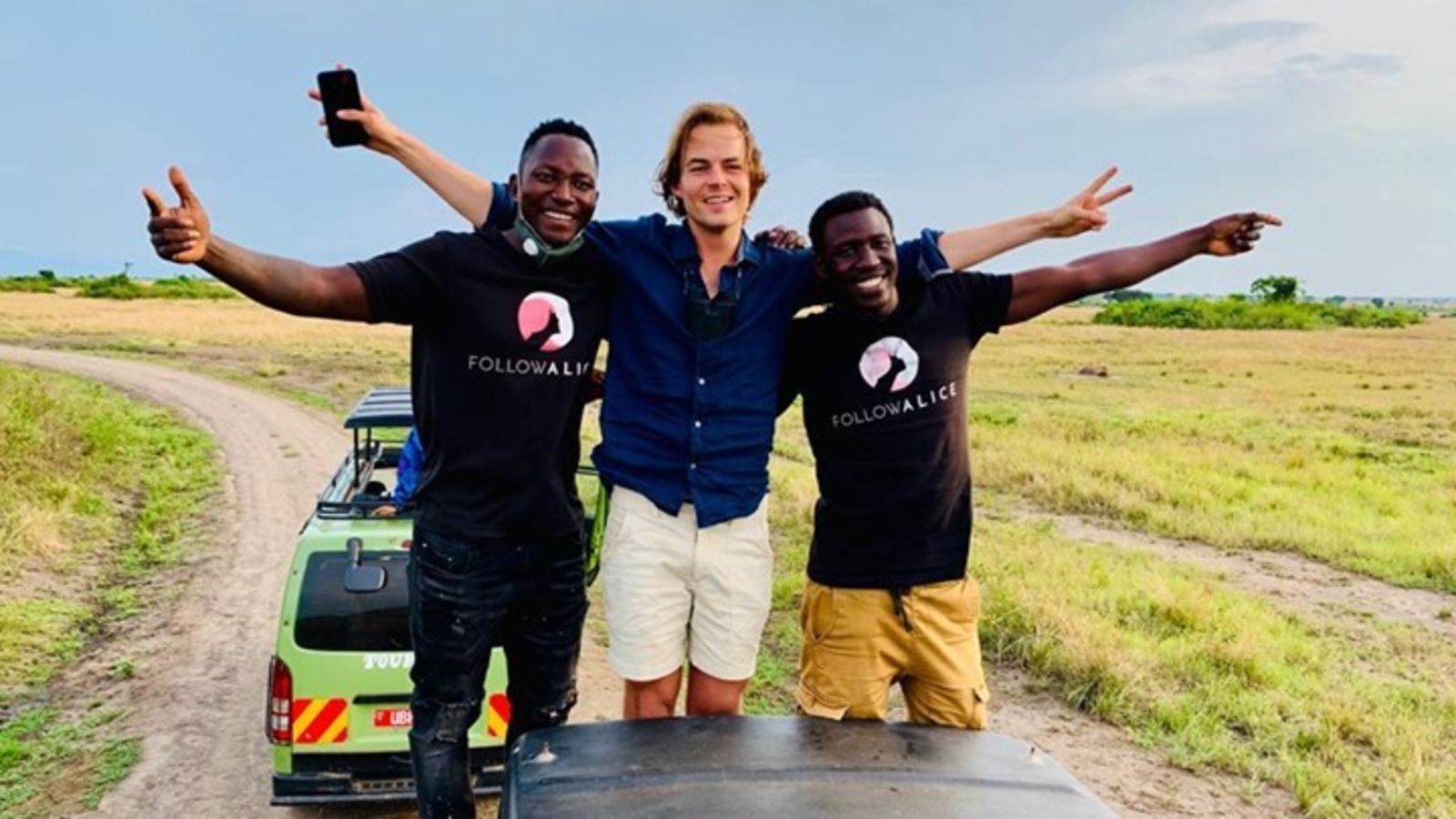 Happy client on serengeti safari with team