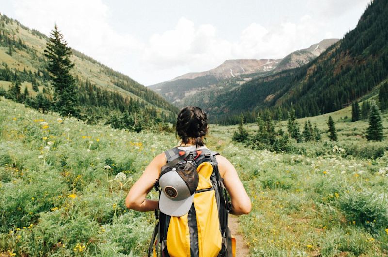 girl hiking mountains 10 things you must know before climbing Kilimanjaro