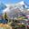 A trekker stands by Tibetan prayer flags near to Namche Bazaar, a town that sits along the Everest Base Camp trail and is a common acclimatisation rest stop