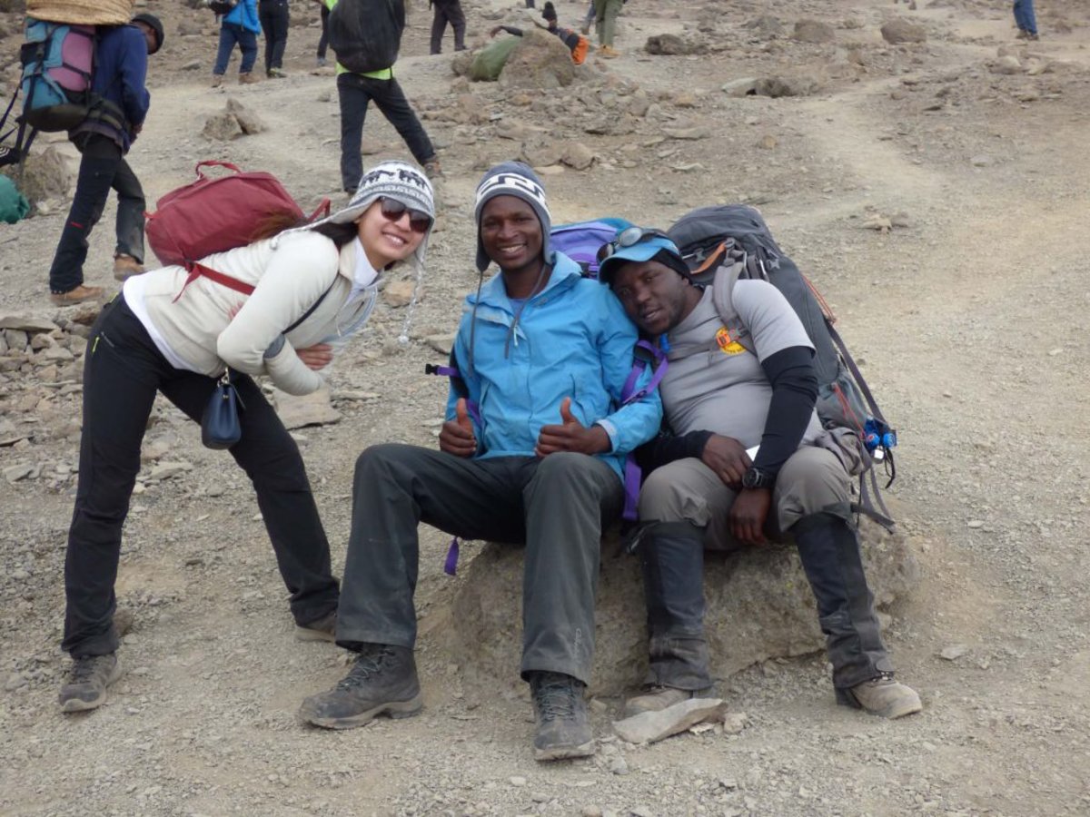 Kilimanjaro trekkers smiling and resting