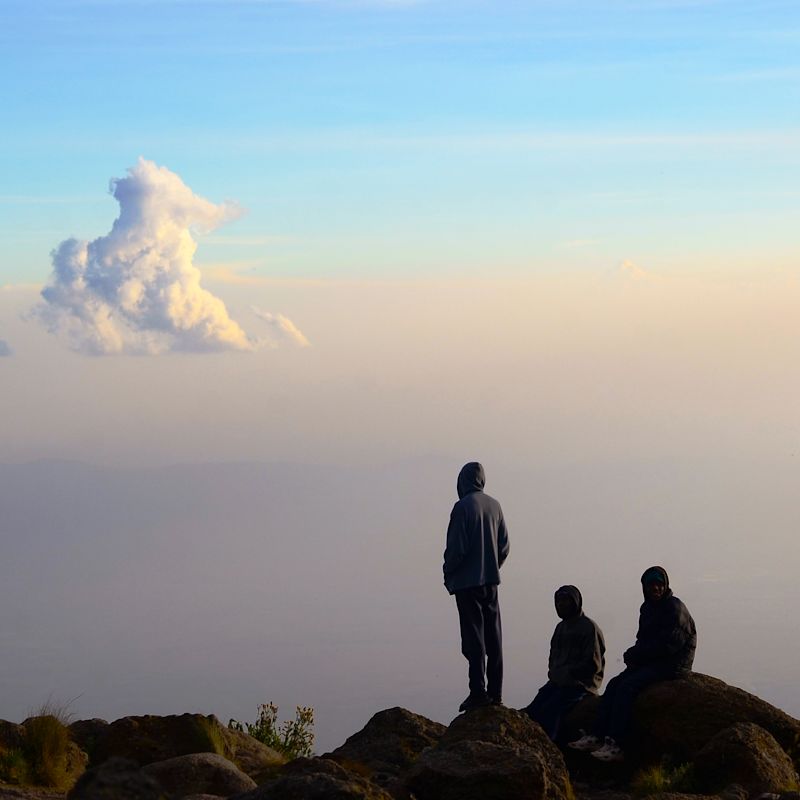 Trekkers and clouds on the Lemosho route, Kilimanjaro