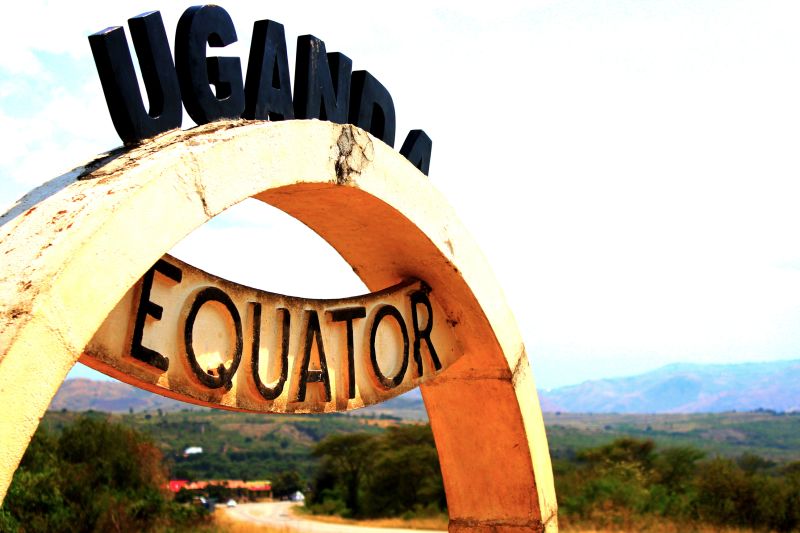 Ours. S. Close up of the Uganda Equator sign