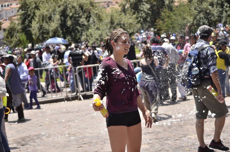 Cusco carnival woman with foam spray can
