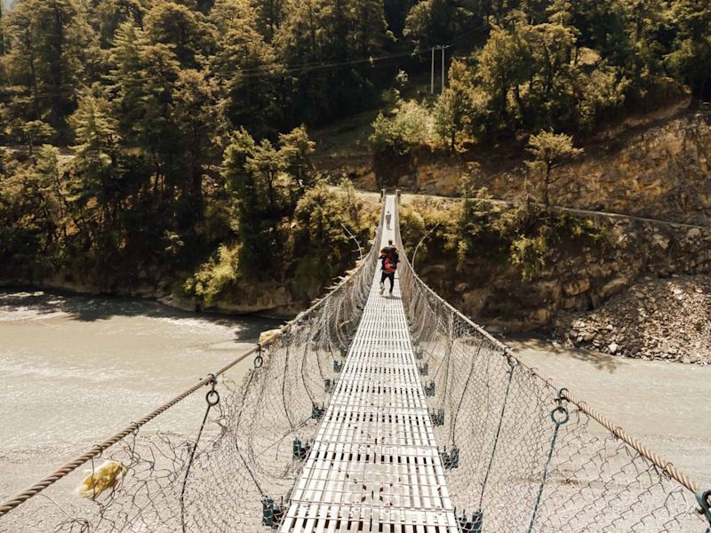 Suspension bridge across river