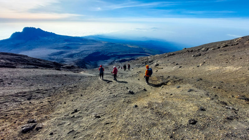 Andrés. Alpine desert and climbers on Kilimanjaro climb