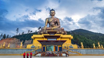 Buddha dordenma statue with monks and tourists in Thimphu, Bhutan
