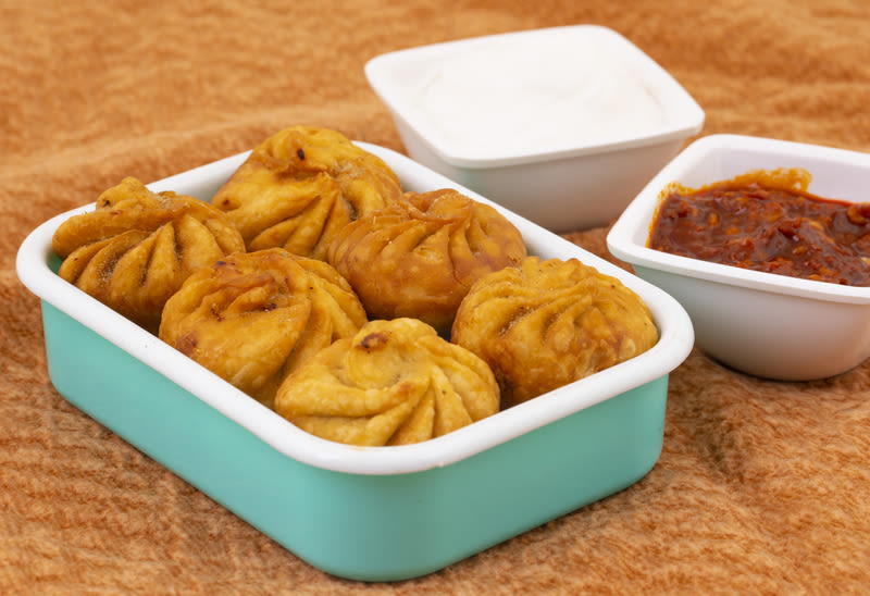 Ours. Fried Momos with Schezwan Sauce in Nepal, takeaway