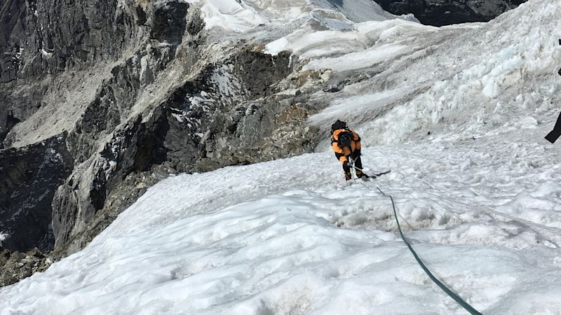 Mountaineering, Everest region. A mountaineer climbing up to the top of Lobuche east peak, Everest region, Nepal