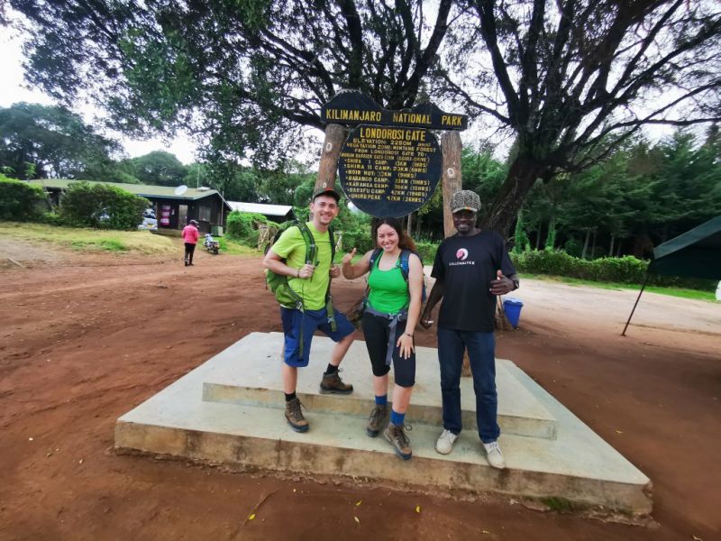 Smiling trekkers at Londorossi Gate on Mt Kilimanjaro