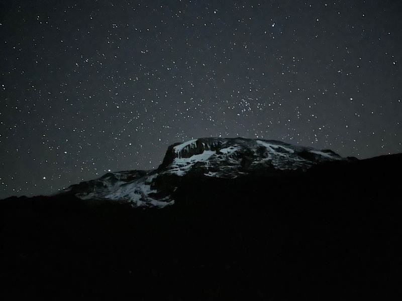 Starry sky and view of Uhuru from Barranco Camp on Kilimanjaro 