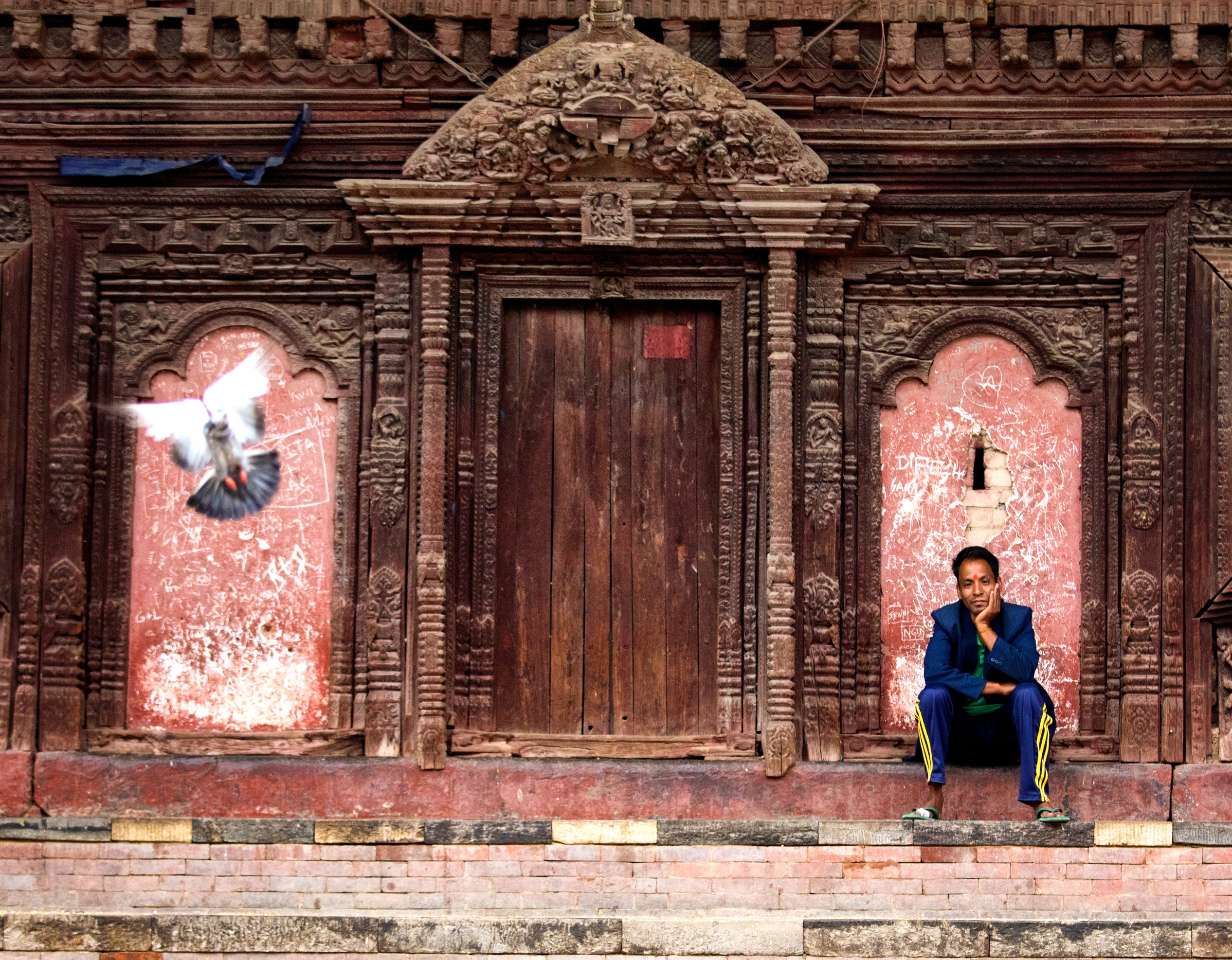 Man and bird at Durbar Square, Kathmandu, Nepal