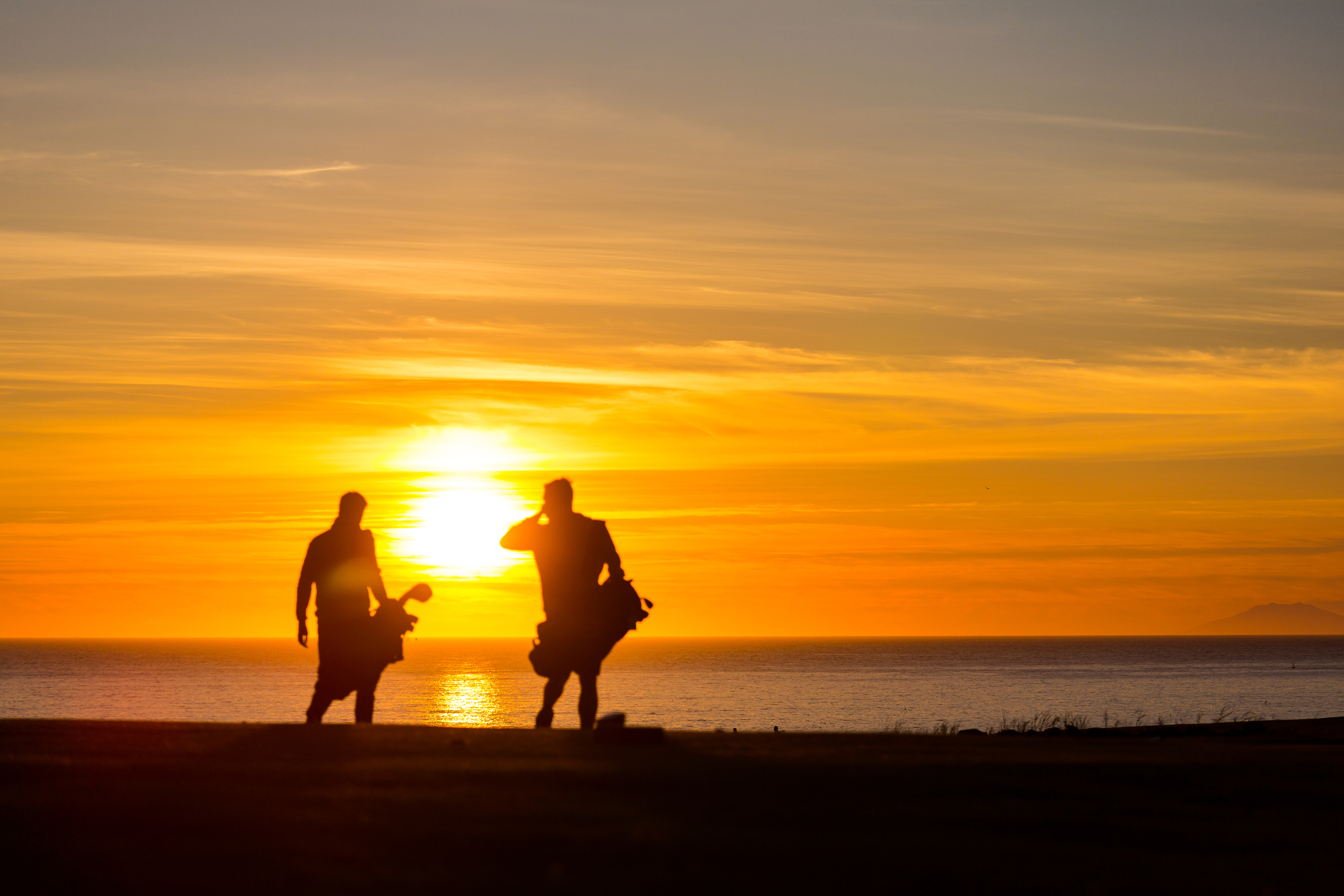 Golfers at the golfcourse Keilir in Hafnarfjorður Iceland playing midnight golf