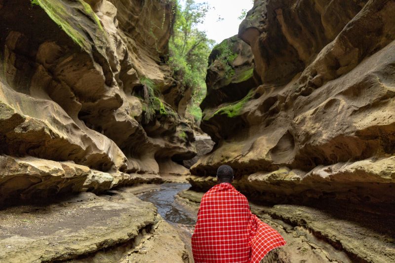 Walking with a Maasai in the Hell-s Gate gorge. Kenya 