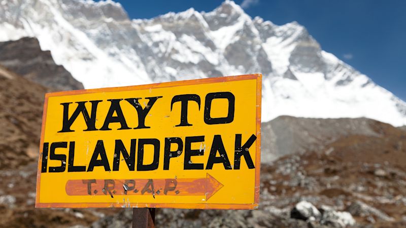 Signpost way to Island peak under Lhotse peak. Signpost way to Island peak (Imja Tse) under Lhotse peak, way to Island peak b.c. - Everest area, Khumbu valley, Sagarmatha national park, Nepal