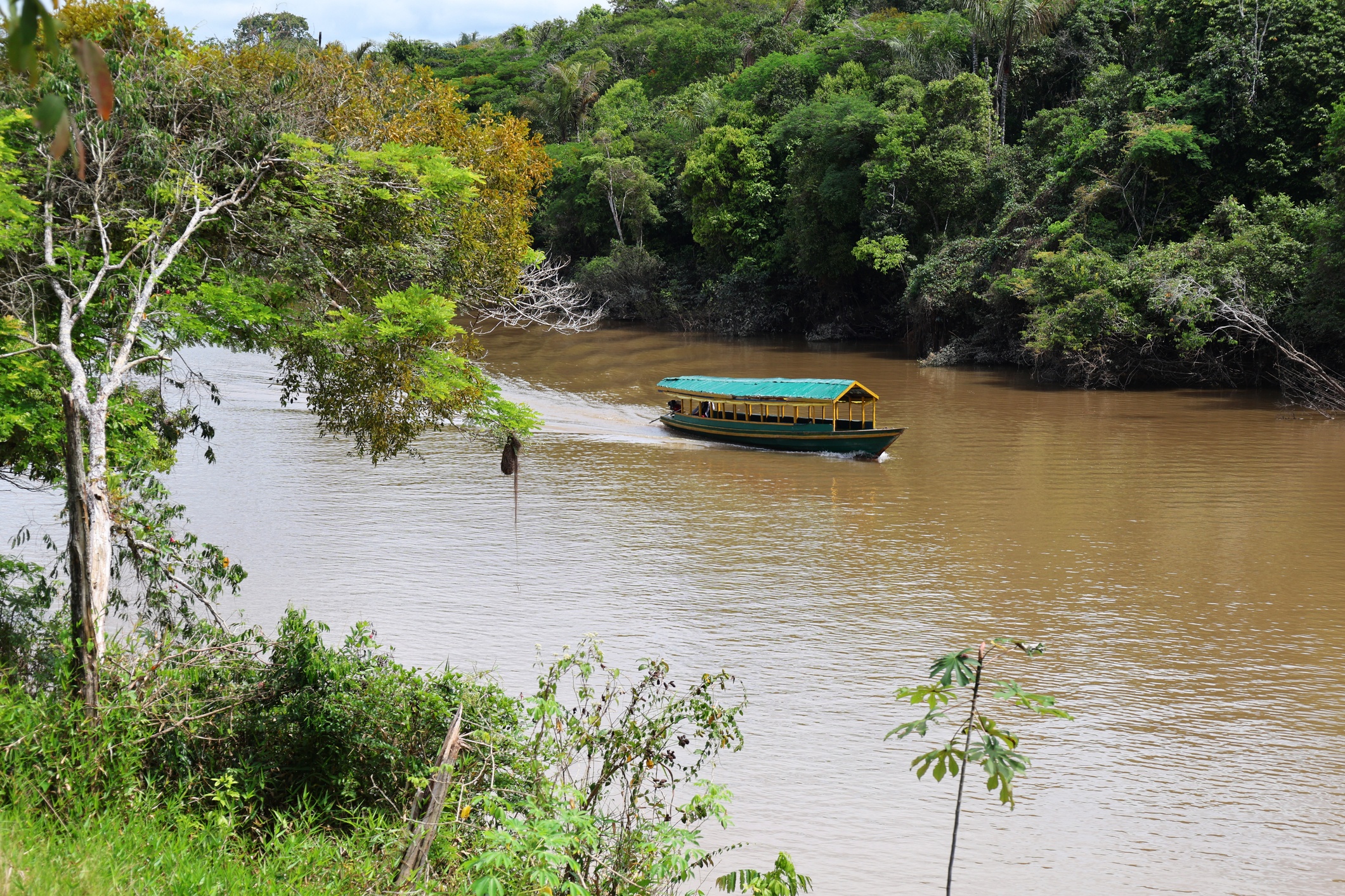 Boat travel on the Rio Momon near Iquitos, Peru.