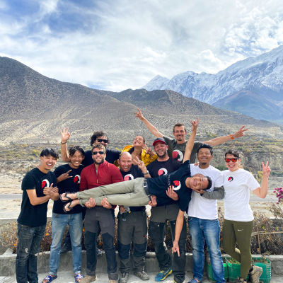 Nepal team with logo and mountains in the background