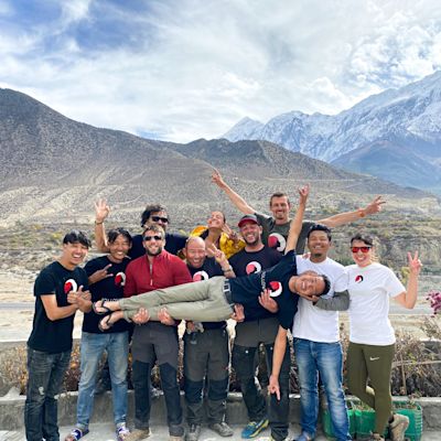 Nepal team with logo and mountains in the background