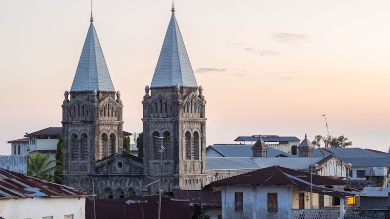 Horizontal photo of the front and the towers of the Roman St Joseph's Catholic Cathedral in Stone Town, Zanzibar, Tanzania, at sunset