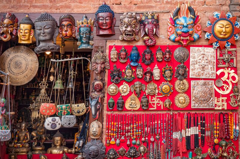 Colourful carved wooden masks and handicrafts on the traditional market in Thamel District of Kathmandu, Nepal
